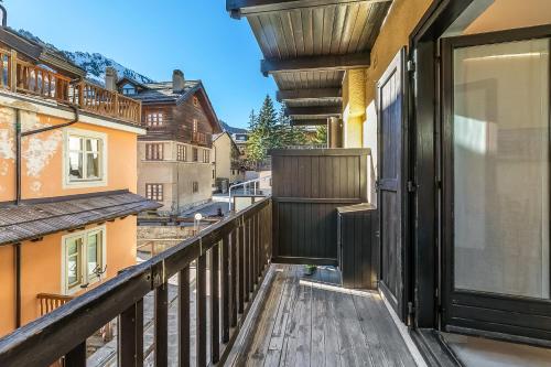 a balcony with a view of a city at Rochebrune Apartments in Ski Resort in Claviere