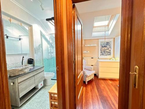 a bathroom with a sink and a toilet and a shower at Apartamento El Rey in Colombres