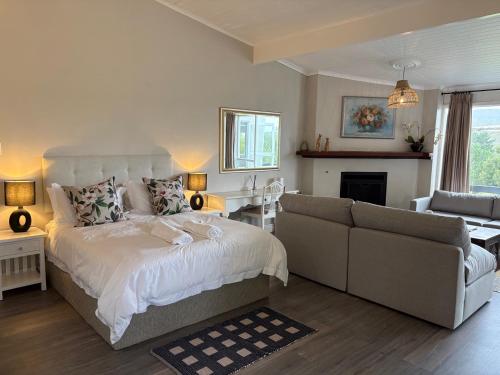 a bedroom with a bed and a couch at The Suite in Stanford