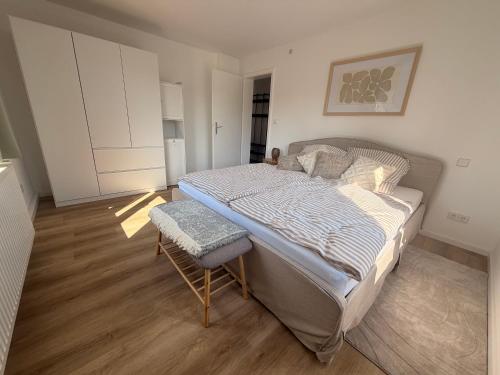 a bedroom with a bed and a chair in it at Cozy Home in Schramberg