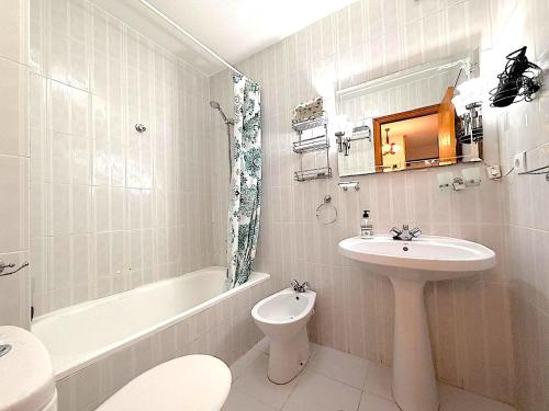 a bathroom with a sink and a toilet and a bath tub at Santa Pola port in Santa Pola