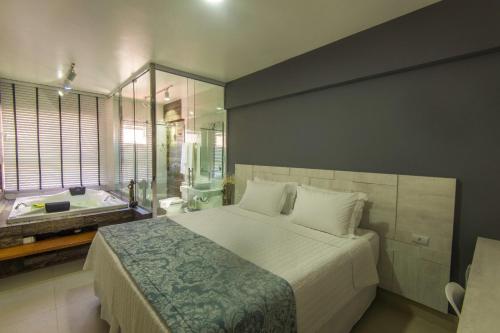 מיטה או מיטות בחדר ב-Cristal Pousada