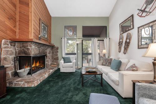 a living room with a couch and a fireplace at Sun Song 3F in Fraser
