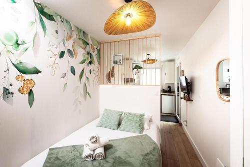a bedroom with a bed with shoes on it at La casa del Platana in Domagné