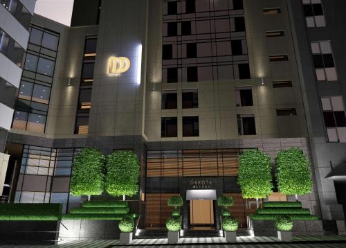 a rendering of the front of a building with plants at Dakota Leeds in Leeds