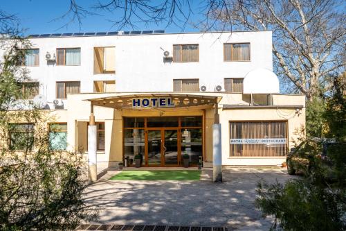 a hotel building with the front door open at Хотелски комплекс Радецки град Козлодуй in Kozloduy