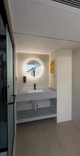 a bathroom with a sink and a mirror at Kolsay tany in Kurmenty