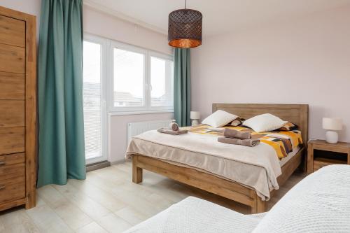 a bedroom with a bed and a large window at Move&Rest Slunj in Slunj