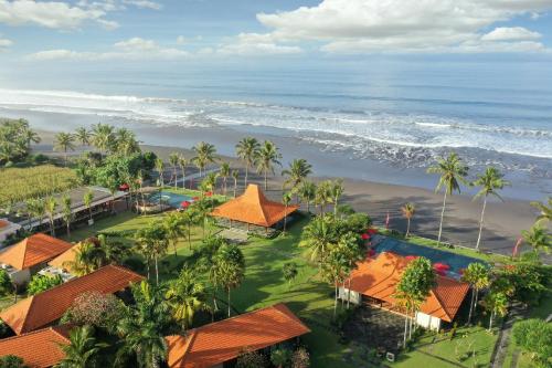 an aerial view of a resort and the ocean at Amarta Beach Retreat by Nakula in Tabanan