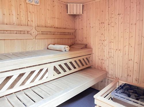 a wooden sauna with two bunk beds in it at WILla Medica in Poznań