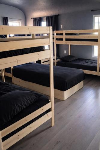 a group of bunk beds in a room at Hoover Vibe Near Public Transportation in Los Angeles