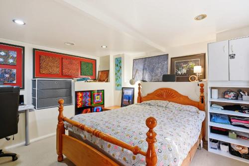 a bedroom with a bed and a desk at Birdcage - King Bed - Walk to CBD in West Hobart