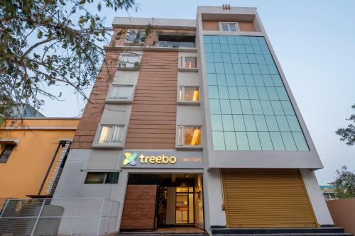 a building with a tiegogo sign in front of it at Treebo Grace Stays in Bhubaneshwar