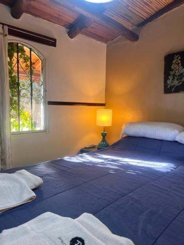 Llit o llits en una habitació de Posada de Nono