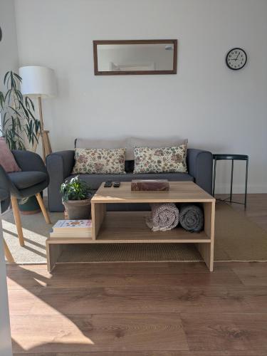 a living room with a couch and a coffee table at Trim private rooms in Trim
