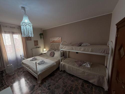 a bedroom with two bunk beds and a crib at Al Bastione B&B in Barletta