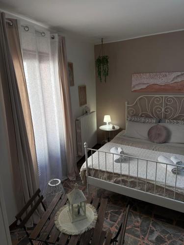 a bedroom with a large bed and a window at Al Bastione B&B in Barletta