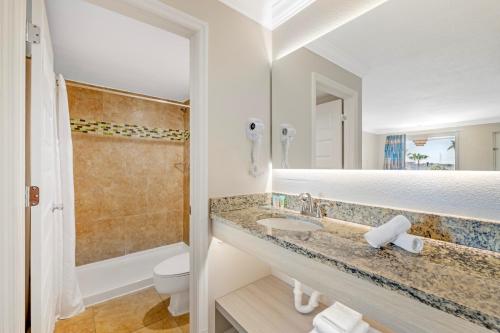 a bathroom with a sink and a toilet at Orlando International Drive North Hotel in Orlando