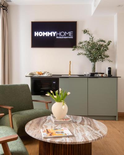 a living room with a coffee table and a tv at Casa Carver 1927 by Hommyhome in Seville
