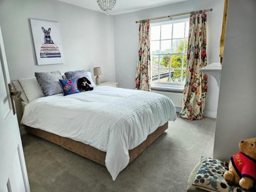 a bedroom with a bed and a window at Landguard - Yarmouth in Yarmouth