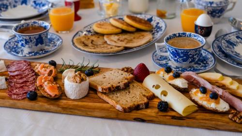 a table with a plate of breakfast foods and drinks at Anima Ocean Lodges in Essaouira