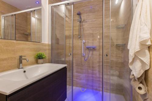 a bathroom with a shower and a sink at Residence Le Piscine in Nardò