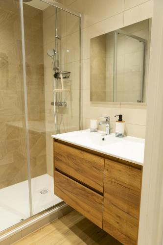 a bathroom with a sink and a shower at Studio Les Epicéas in Boersch