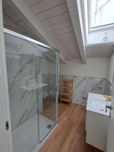 a bathroom with a glass shower in a room at b&b Civico 30 in Lonato