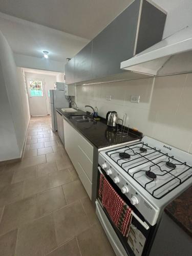 a kitchen with a stove and a stove top oven at Casa Kempes in Córdoba