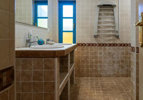a bathroom with a sink and a mirror at Finca Antas Villa in Antas