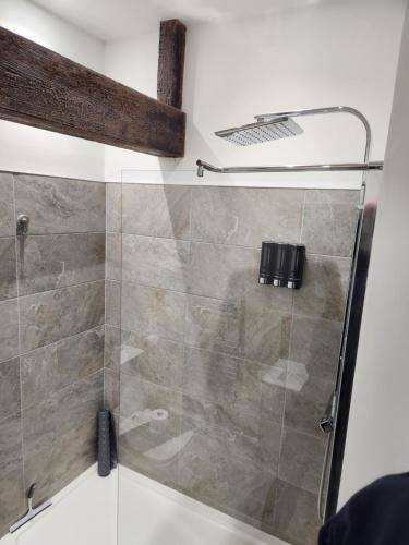 a shower with a glass door in a bathroom at C&B Holdings in Hull