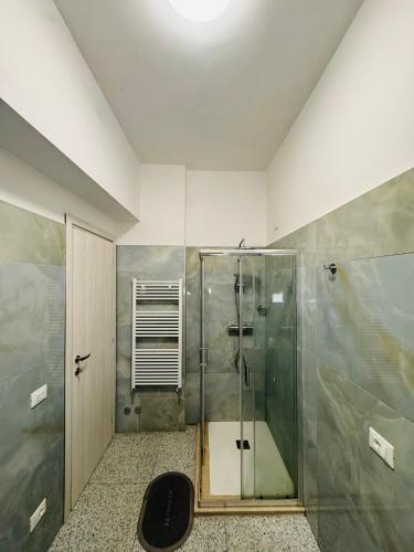 a bathroom with a shower with a glass shower stall at MMM HOME Train Station 1 in Mestre