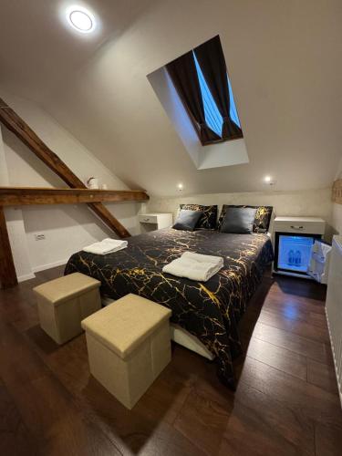 a bedroom with a large bed with a window at TOMISLAV in Zagreb