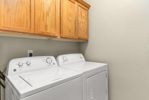 a laundry room with a washer and dryer at Beacon at the Lakes Cozy 2b2b, Grnd Level Condo in Windsor
