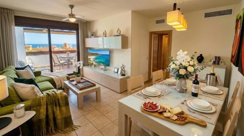 a living room with a couch and a table at La Cala Center Premium Penthouse Motorized Terrace & Sea Views in La Cala de Mijas