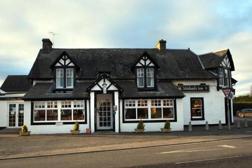a black and white building on the side of a street at St Michaels Hotel in St. Michaels