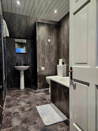 a bathroom with a bath tub and a sink at St Michaels Hotel in St. Michaels