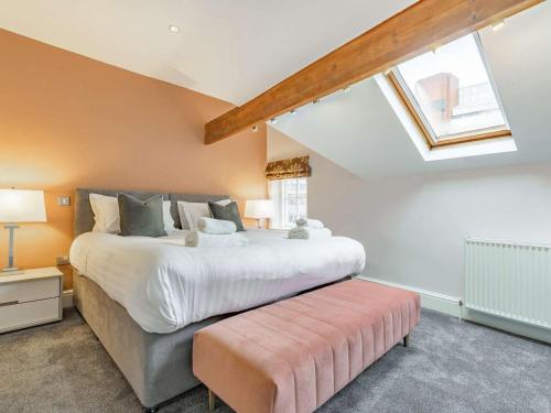 a large bedroom with a large bed and a skylight at 2 Bed in Harrogate oc-hh029 in Harrogate