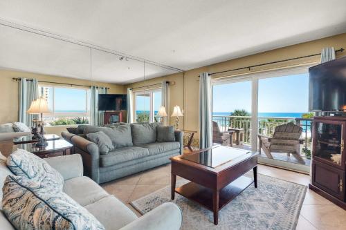 a living room with a couch and a table at Destin Towers 32 in Destin