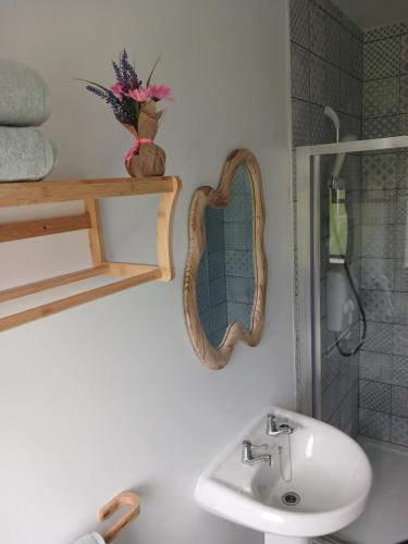 a bathroom with a sink and a mirror at Mountain hideaway in Finny