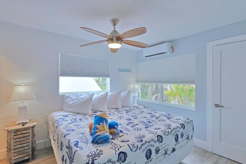 a child sitting on a bed in a bedroom at The Inn on Siesta Key in Siesta Key