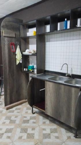 a kitchen with a sink and a counter top at royal care villas in Thika