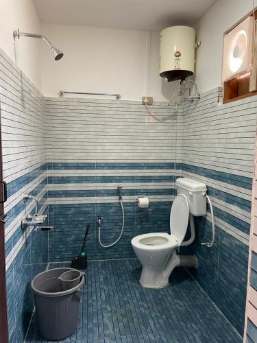 a bathroom with a toilet and a shower at Chug Ling Serene in Chug