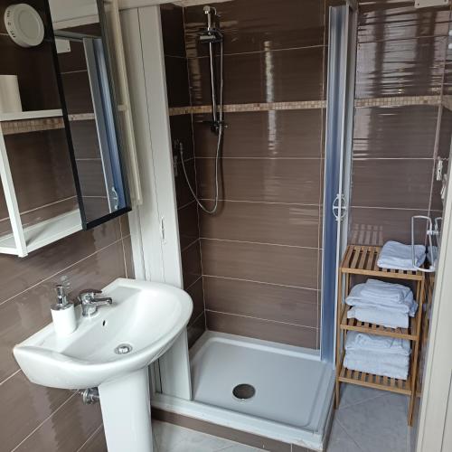 a bathroom with a shower and a sink and a toilet at Residenza Cairoli in Cupello
