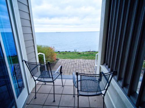 two chairs on a balcony looking out at the ocean at Beacon Pointe on Lake Superior in Duluth
