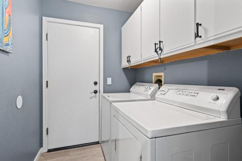 a laundry room with a washer and dryer at Private Pool & Fire Pit: Tucson Home Near Hiking! in Tortolita