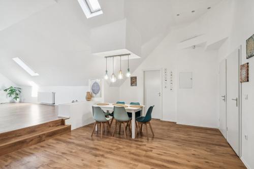 a kitchen and dining room with a table and chairs at Natururlaub Eifel-Mandala Feriewohnung in Kall