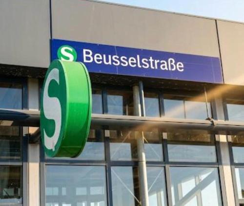 a sign for a building with a sign for a businessistle at Hotel Sickinger Hof in Berlin