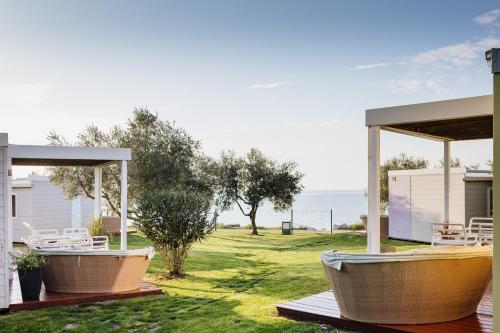 a house with a view of the ocean at Mobile Homes Sunset Beach in Umag