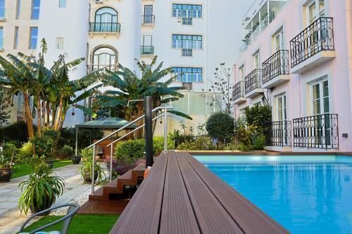 a swimming pool in front of a building at TM Luxury Apartments Lisbon in Lisbon